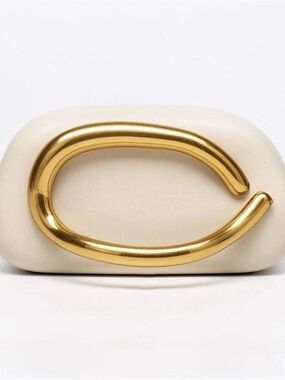 Elegant Cream Clutch with Statement Gold Handle